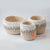 DHL120 SET OF THREE CREAM AND WHITE MACRAME AND SHELL SMALL BASKETS