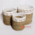 MRC065 SET OF THREE BROWN SEAGRASS AND WHITE RAFFIA BASKETS WITH SHELL DECORATION
