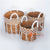 MRC242 SET OF THREE NATURAL BANANA FIBER BASKETS WITH WHITE ROPE DECORATION AND HANDLES