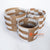 MRC261 SET OF THREE NATURAL MENDONG AND WHITE RAFFIA BASKET WITH HANDLES
