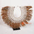ROB004 WHITE SHELL NECKLACE ON STAND DECORATION WITH NATURAL MENDONG FRINGE